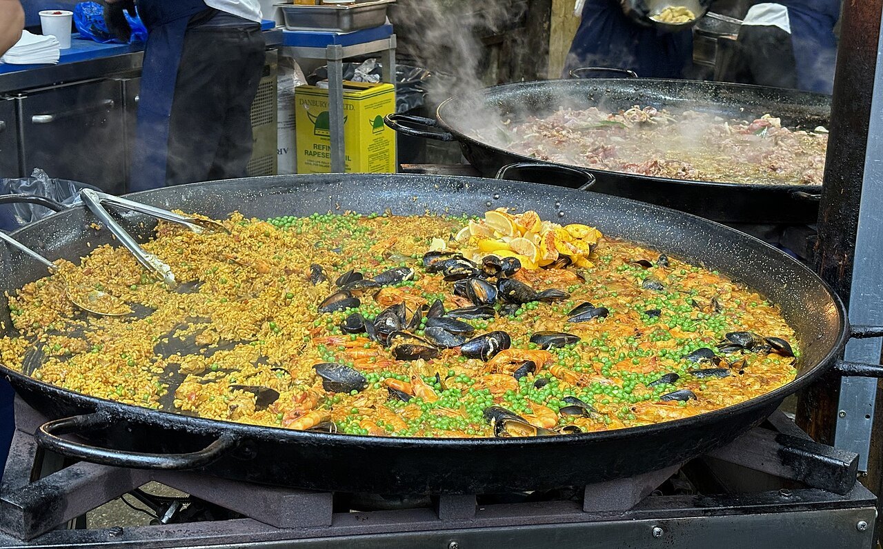 A huge pan of paella with mussels on a stall at Borough Market