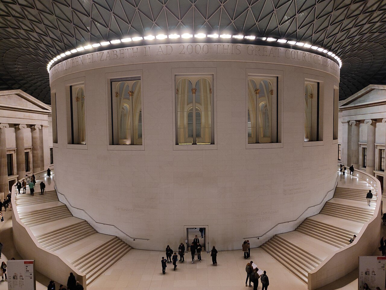 The Great Court at night, a ring of lights around the foot of the roof