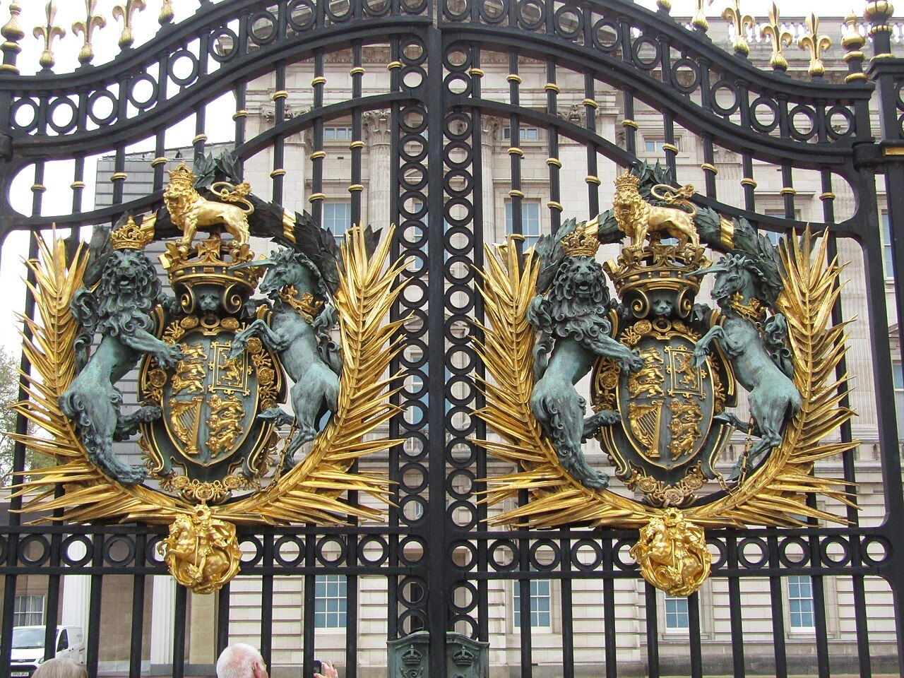 A pair of royal arms in gilt and enamel on the iron gates of Buckingham Palace