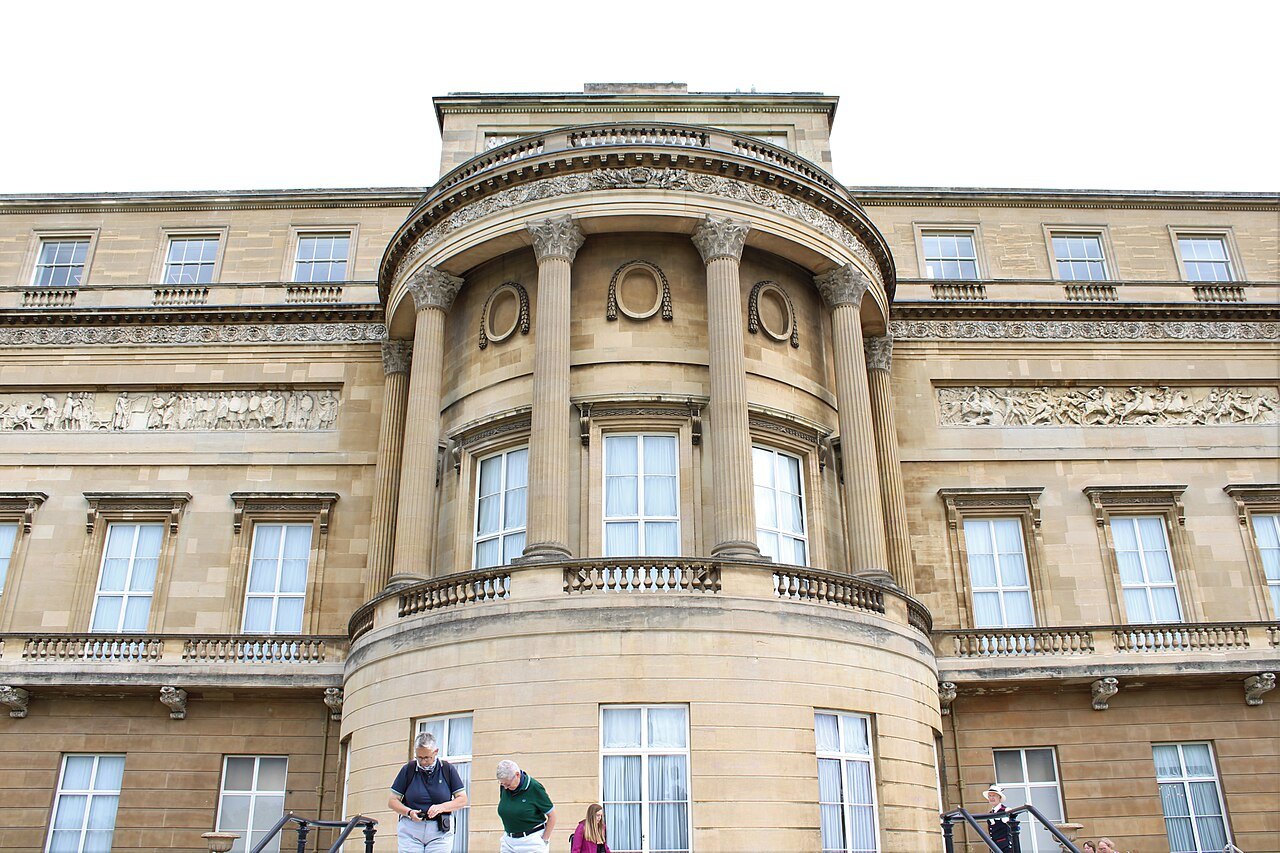The curved bay of the garden front of Buckingham Palace, seen from the path round the lawn