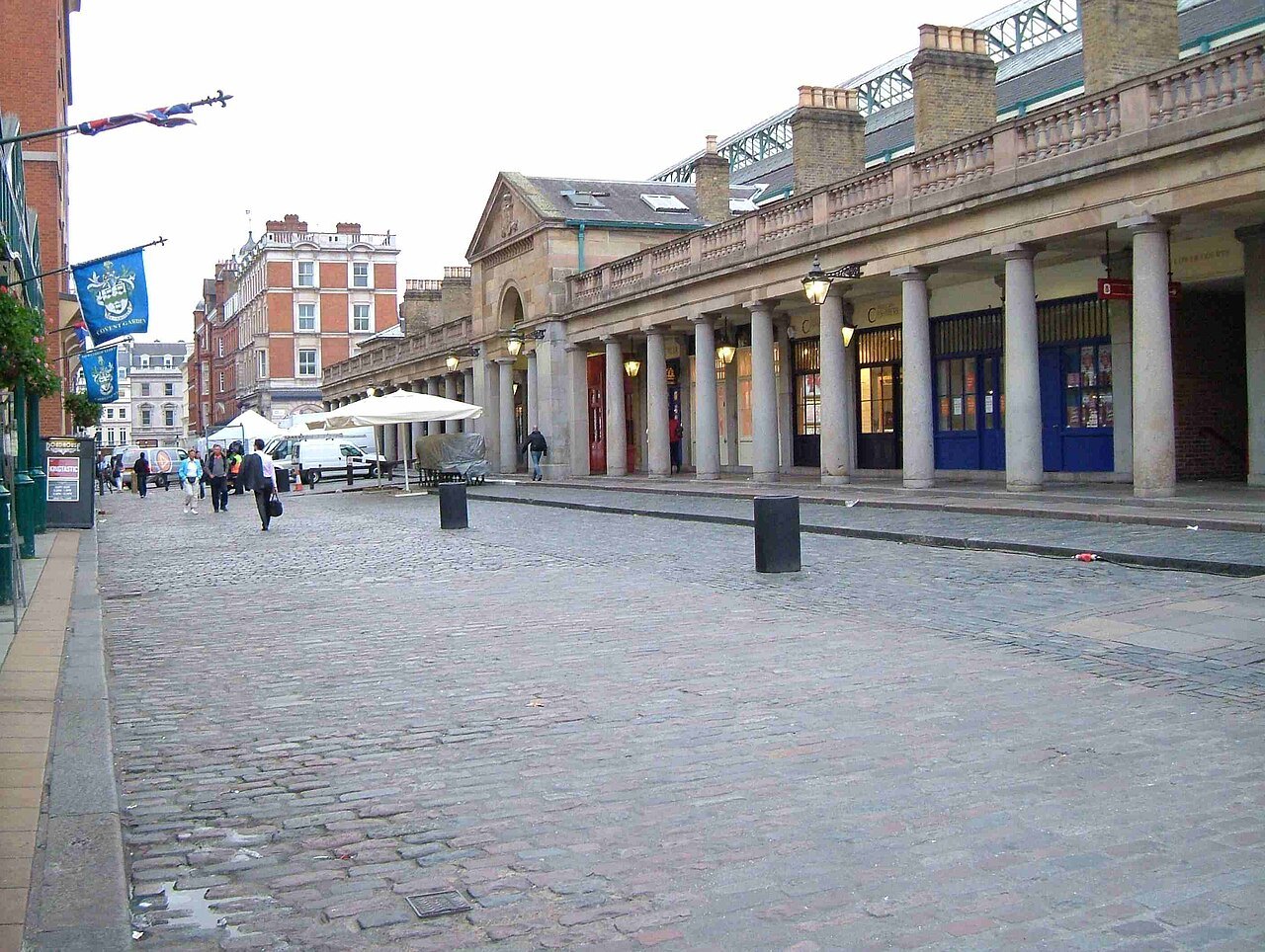 The pillared south front of the Covent Garden market building, seen from a quiet cobbled street