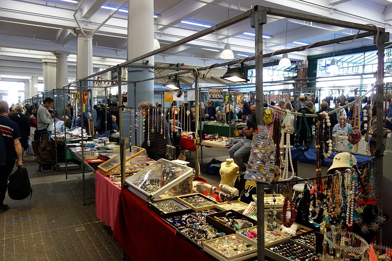 Jewellery, scarves and other goods on a stall under the market roof at Covent Garden