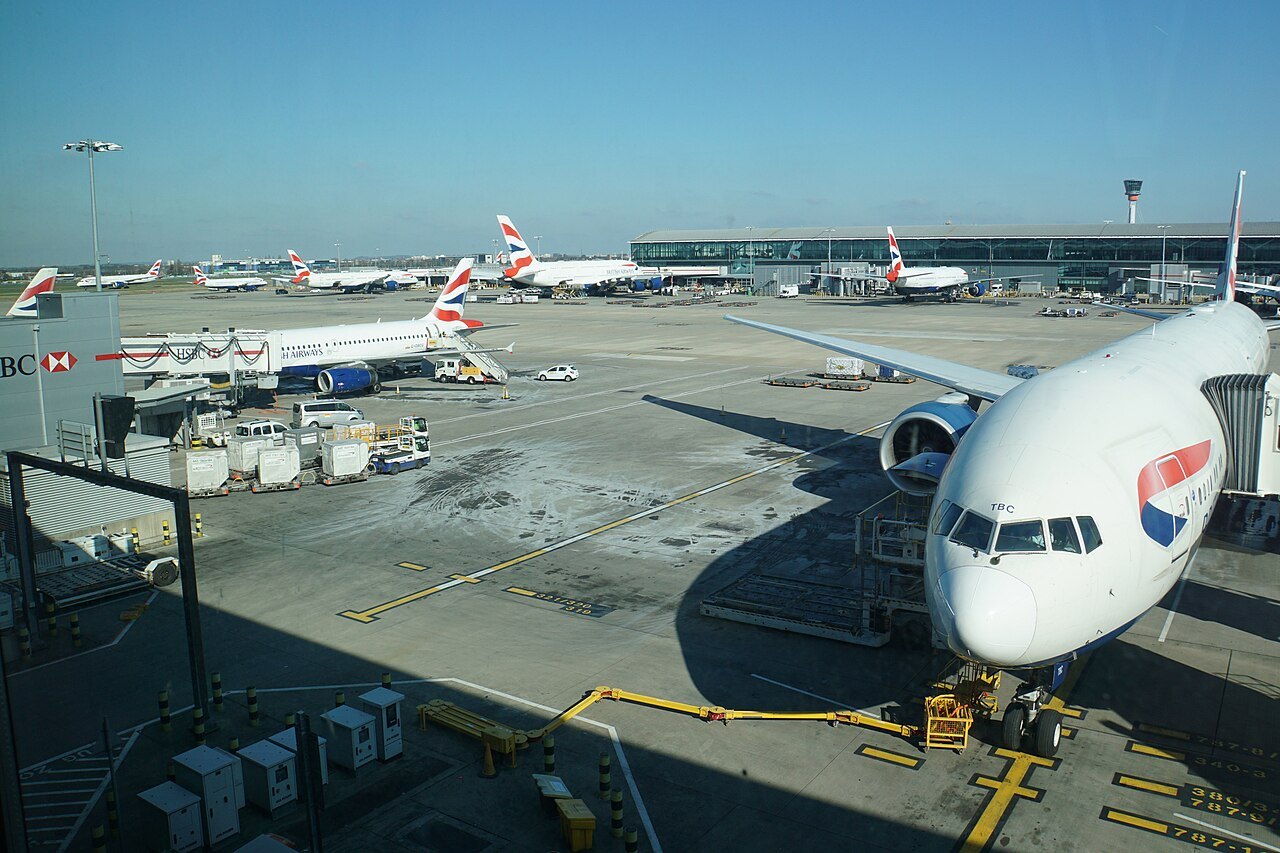 A British Airways jet at its stand at Heathrow Terminal 5, with more aircraft on the apron beyond