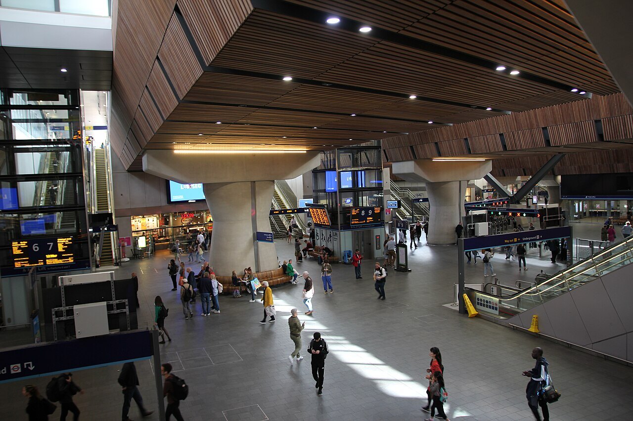 The concourse at London Bridge station, with passengers crossing under a timber-lined ceiling