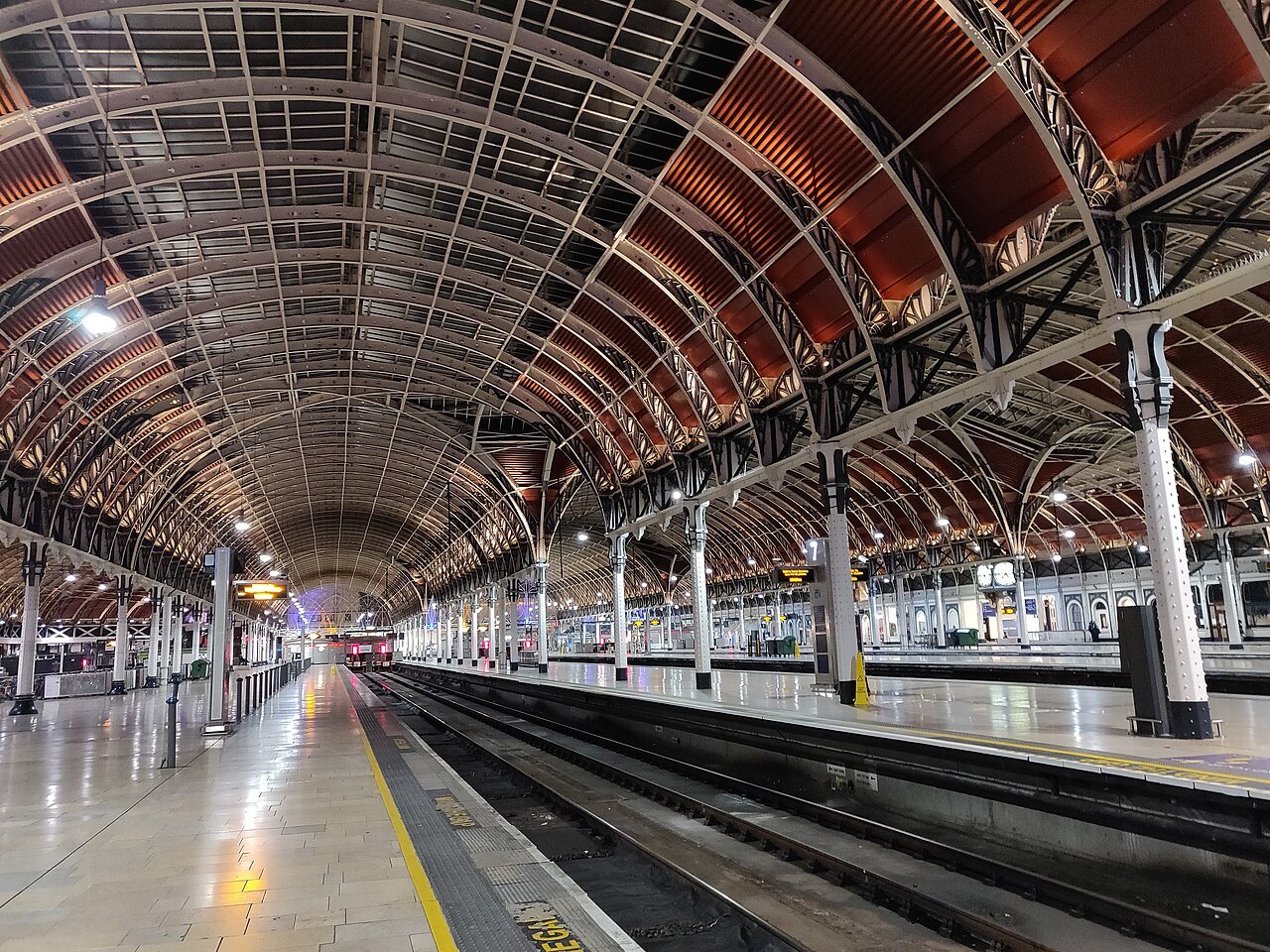 Looking down the platforms of Paddington station under the arched roof
