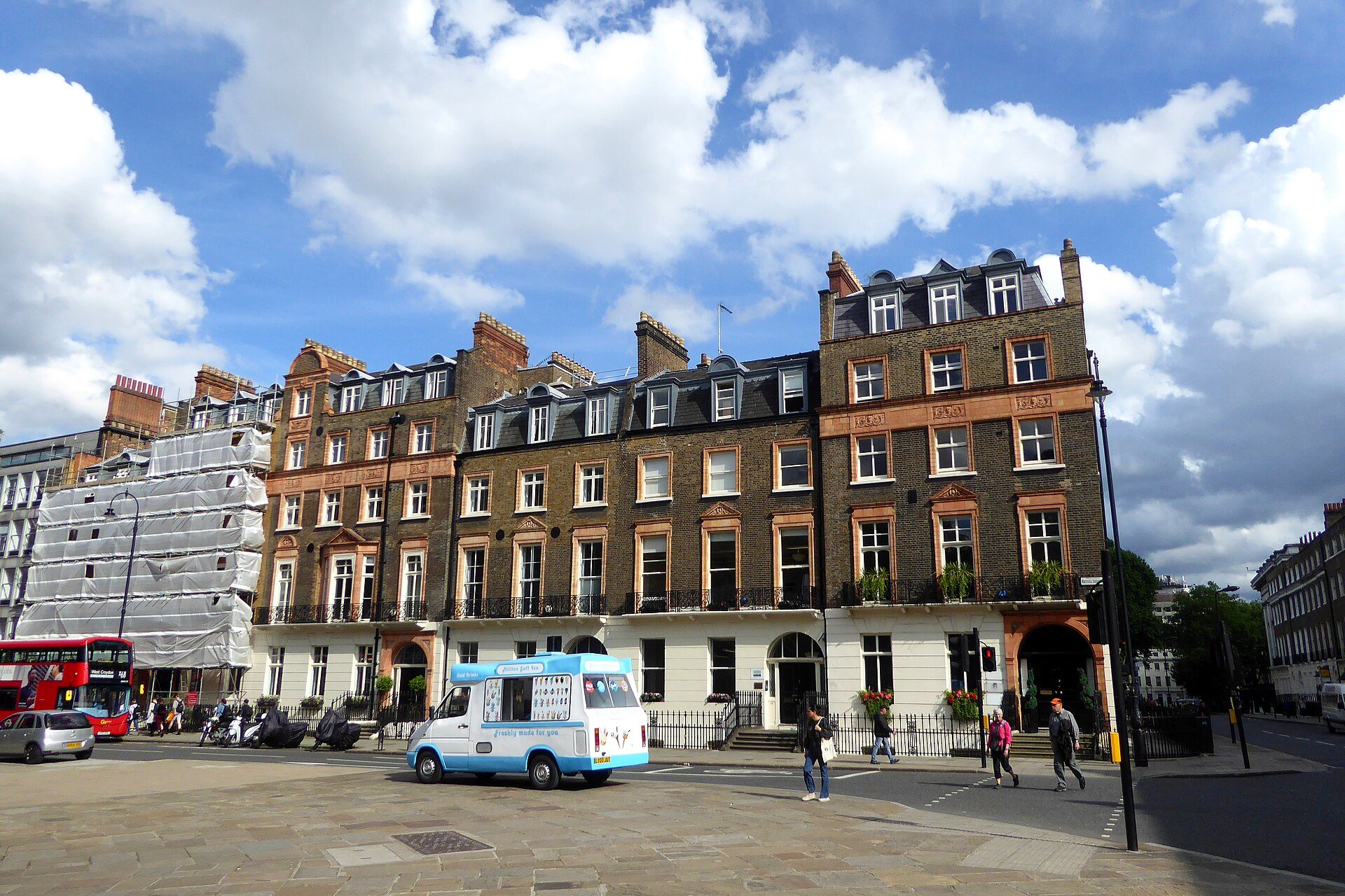 A terrace of brick houses on Russell Square in Bloomsbury, with an ice-cream van at the kerb