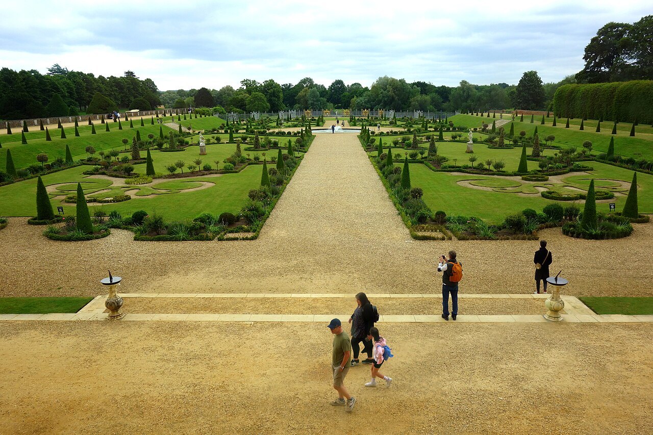 The sunken formal gardens at Hampton Court Palace, with clipped hedges and a gravel path