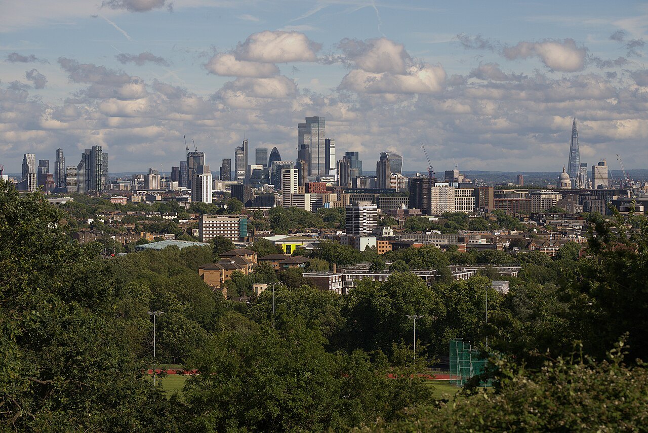 London's skyline from Parliament Hill, the City's towers and the Shard beyond the trees