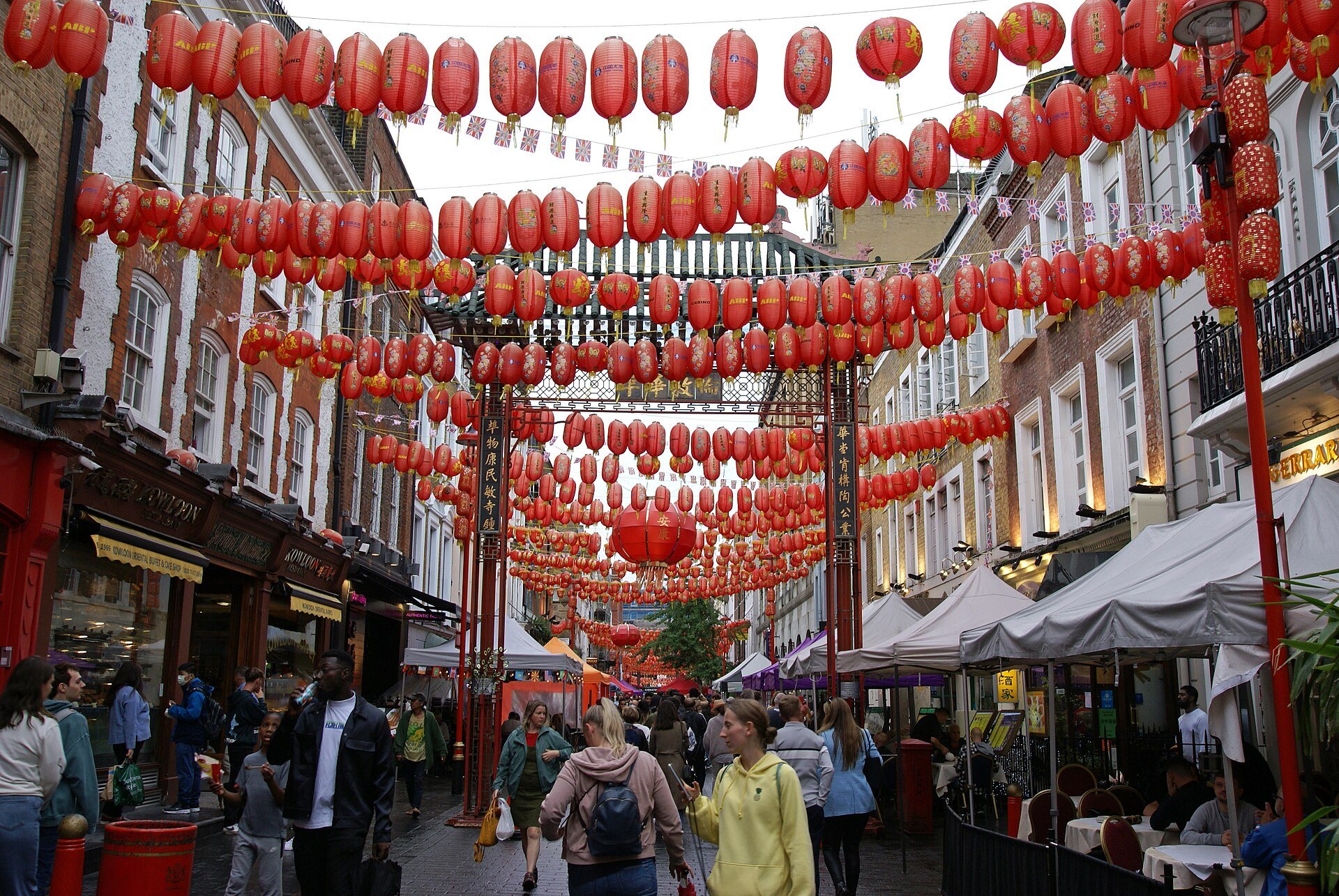 Paper lanterns hung across a crowded street in Chinatown
