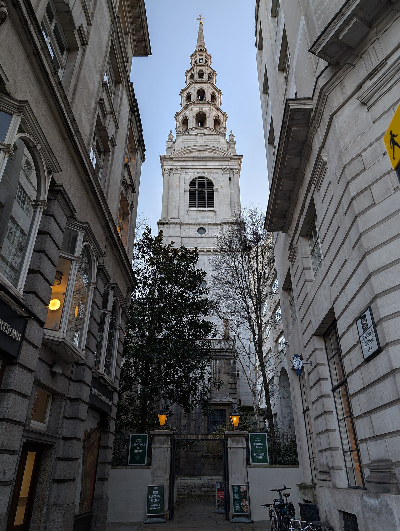 St Bride's Church on Fleet Street, its layered white steeple seen between tall buildings