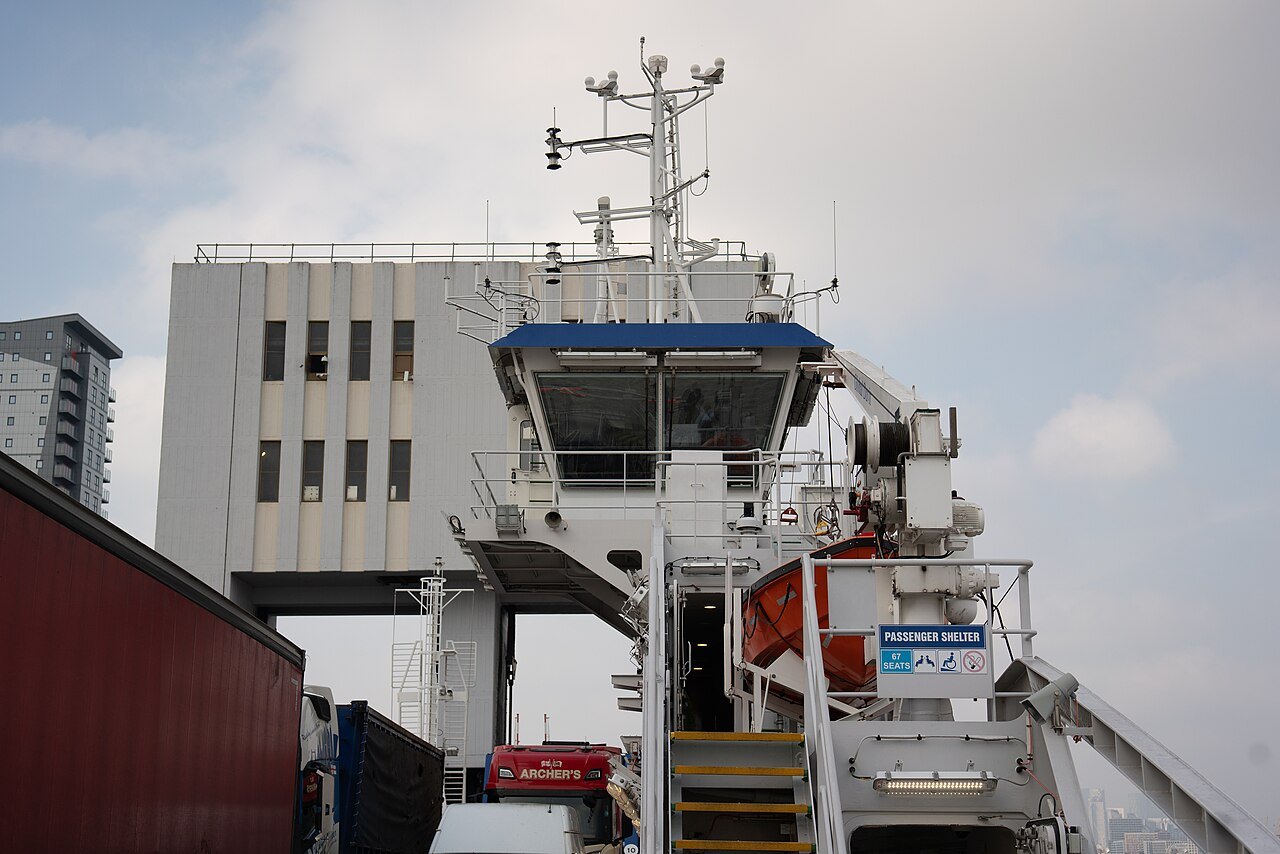 The bridge of a river ferry with its ramp lowered at the Woolwich pier