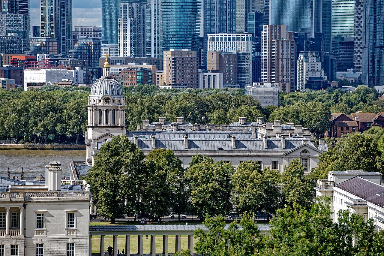 The domes of the Old Royal Naval College and the Queen's House from above, with Canary Wharf behind
