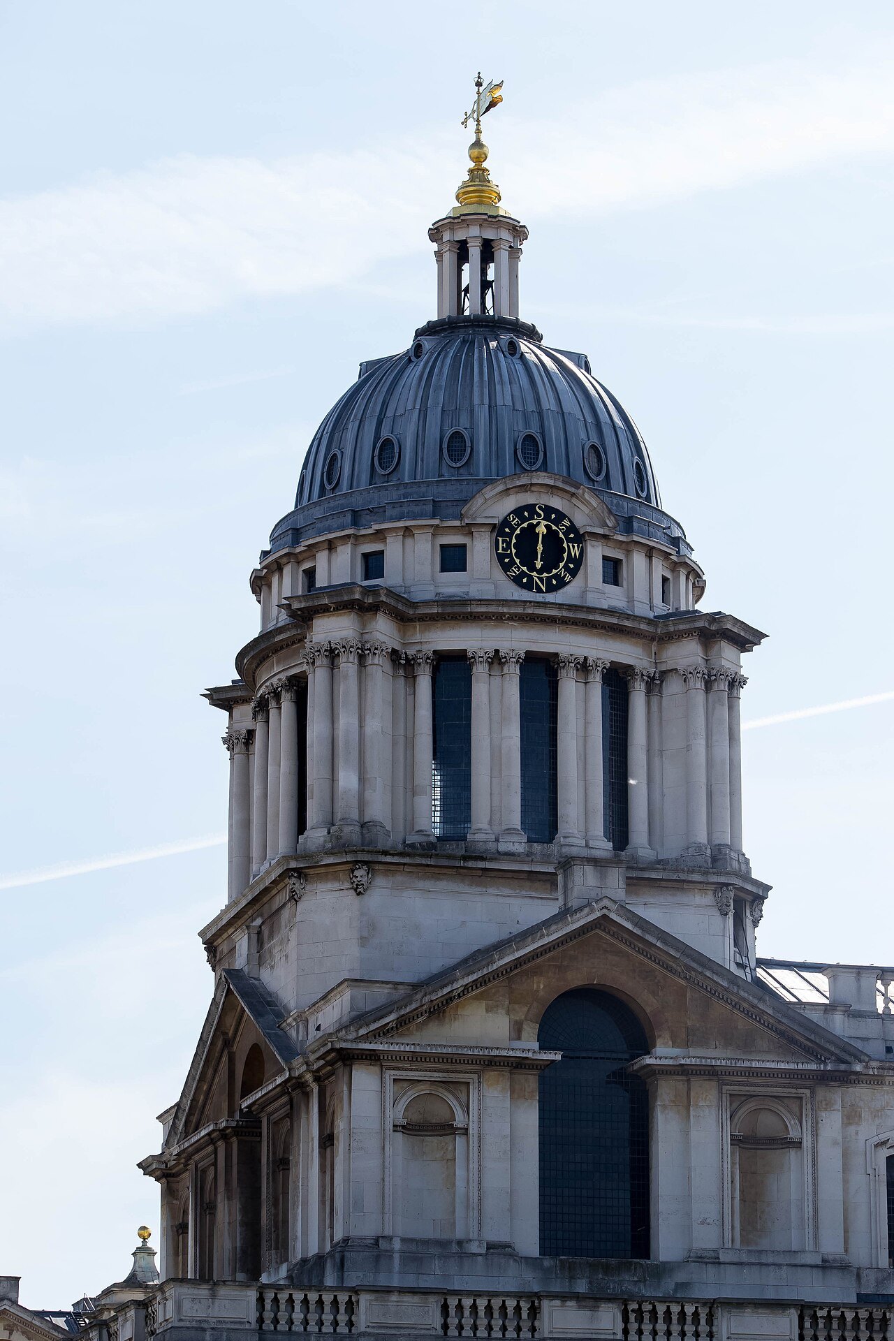 The domed tower of the Old Royal Naval College at Greenwich against a pale sky