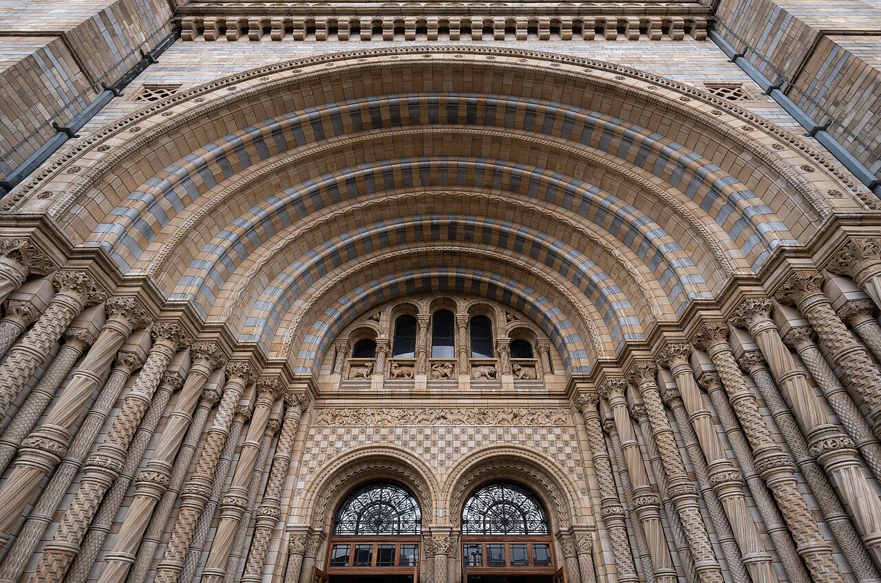 The great carved arch of the Natural History Museum's entrance, in layers of terracotta