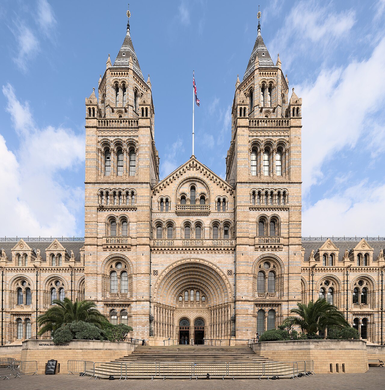 The twin-towered front of the Natural History Museum seen straight on from the steps