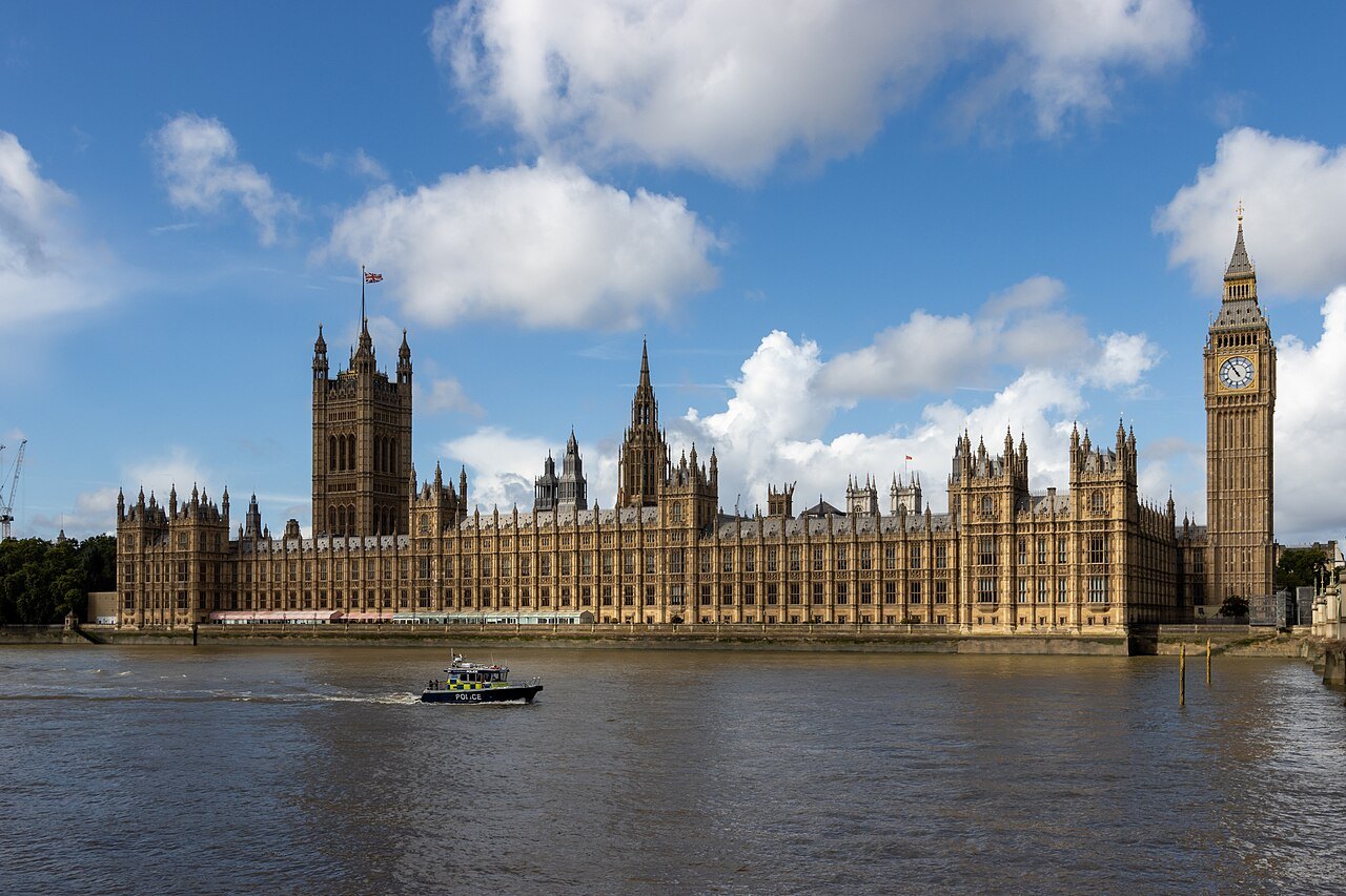 The Victoria Tower, the palace and the Elizabeth Tower across the river on a bright day
