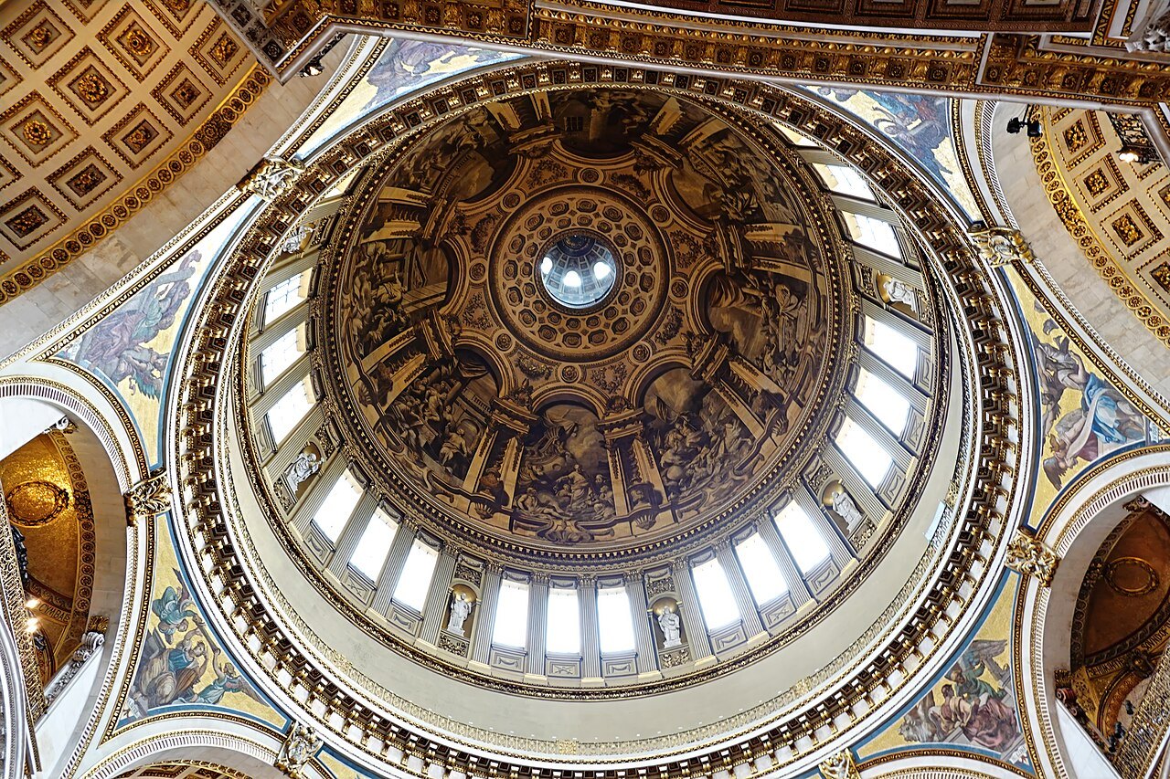 The inner dome of St Paul's Cathedral seen from below, with its painted panels and ring of windows
