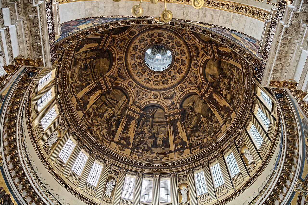 The inner dome of St Paul's Cathedral, its gilded ribs and painted panels seen from the floor