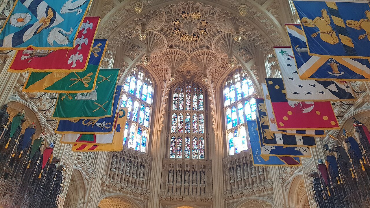 Banners and a fan-vaulted ceiling above the knights' stalls in the Henry VII Chapel